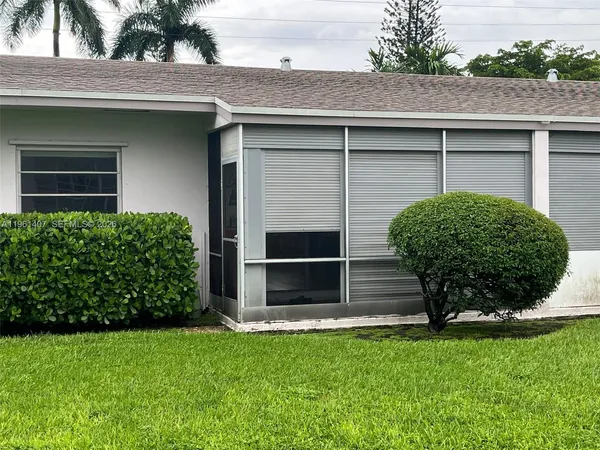 a house view with a garden space