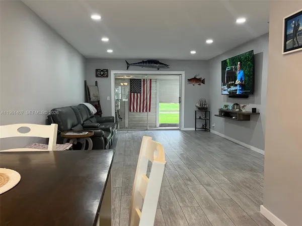 a view of a living room and dining room