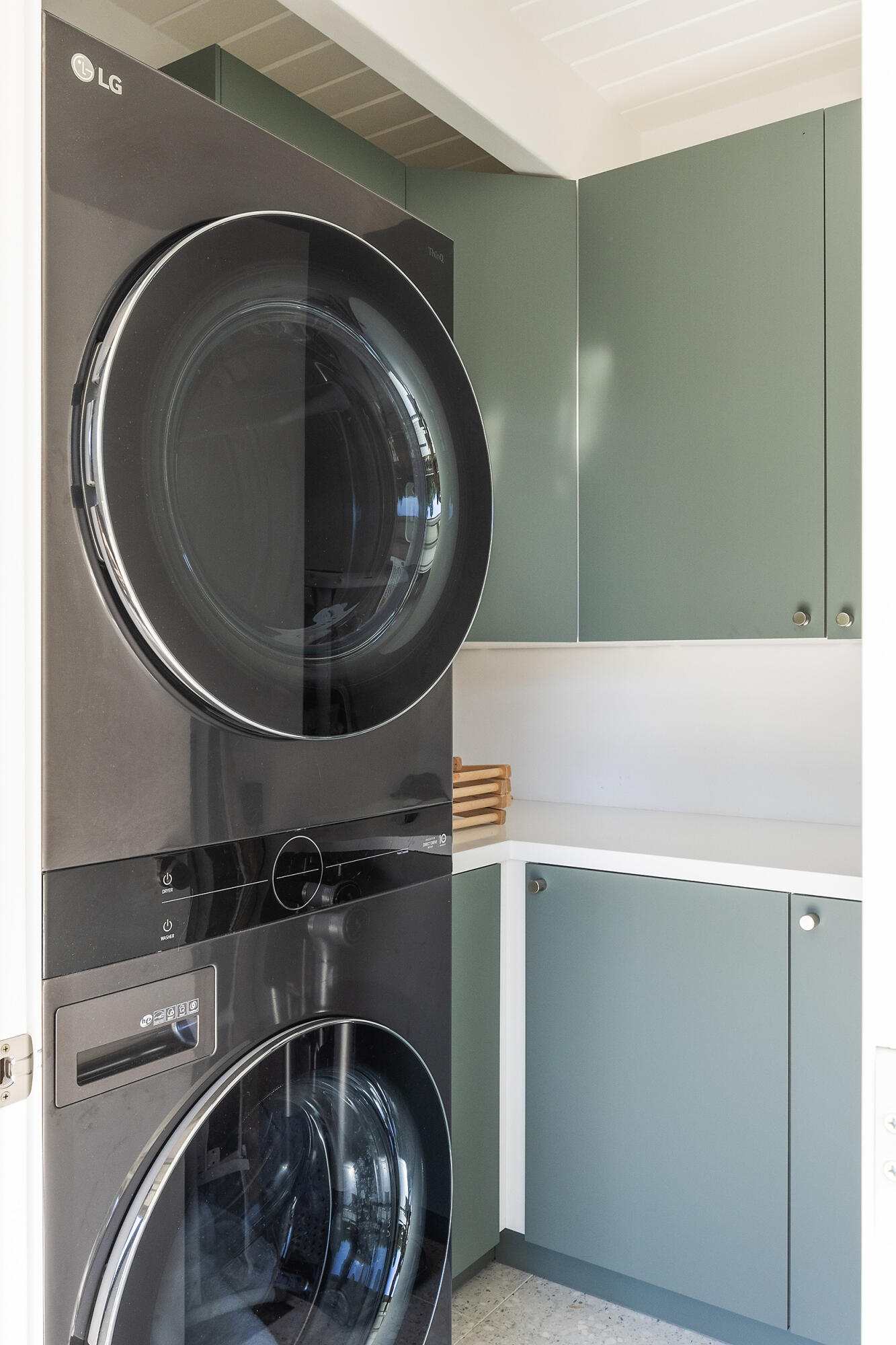 820 Summit Road Montecito, CA 93108 - Photo 24 of 29 a utility room with a light fixture and a washer dryer
