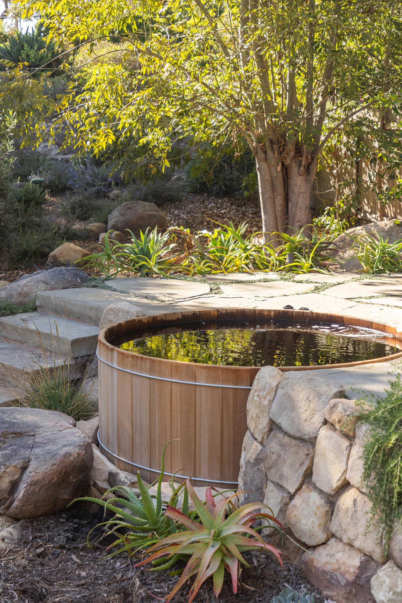 820 Summit Road Montecito, CA 93108 - Photo 27 of 29 a wooden bench sitting in a backyard