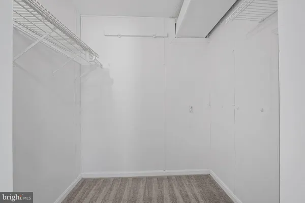 a bathroom with a double vanity sink mirror and toilet