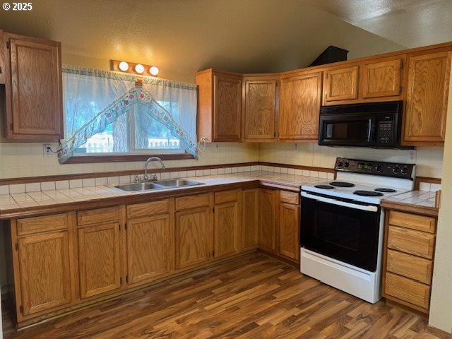 1645 4th Street Haines, OR 97833 - Photo 15 of 26 a kitchen with stainless steel appliances granite countertop a stove a sink and a microwave