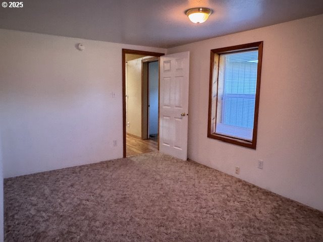 1645 4th Street Haines, OR 97833 - Photo 22 of 26 an empty room with windows and closet