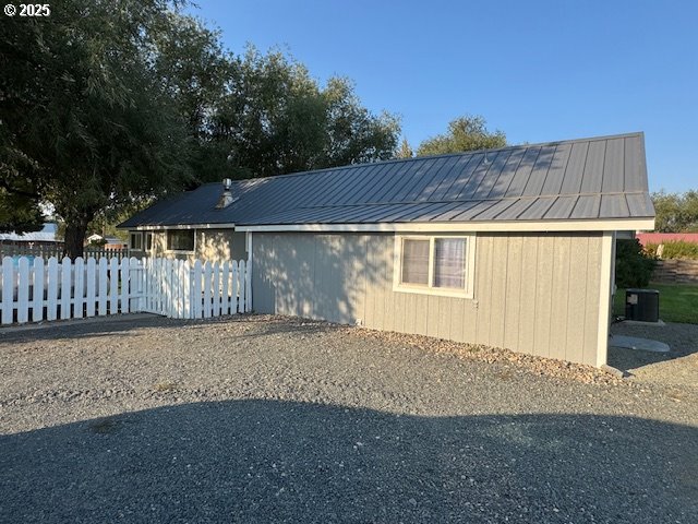 1645 4th Street Haines, OR 97833 - Photo 5 of 26 a front view of a house with a yard