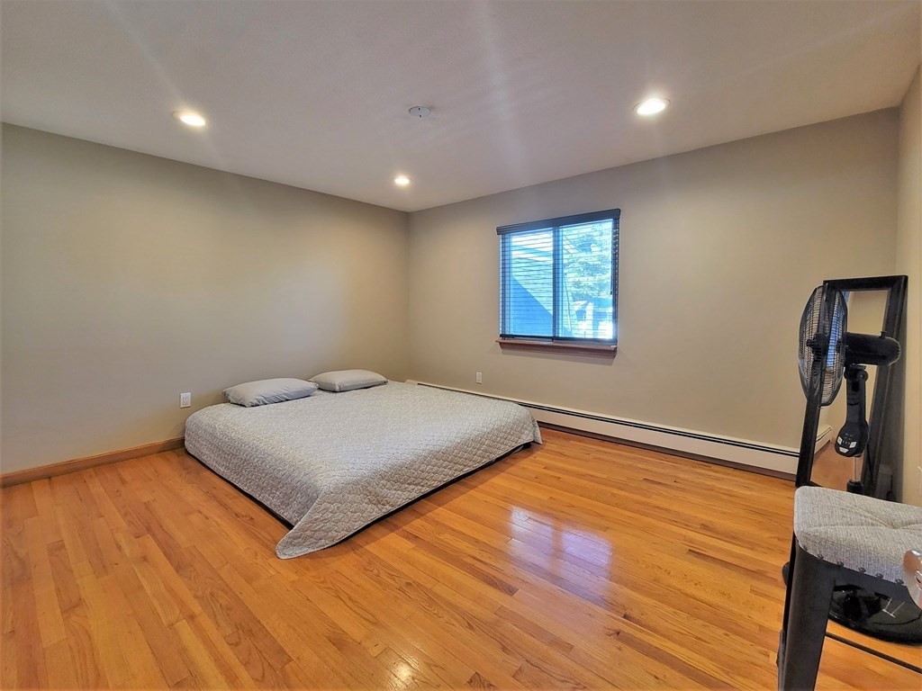 38 Will Drive, Unit 42 Canton, MA 02021 - Photo 15 of 25 a bedroom with a bed and a window