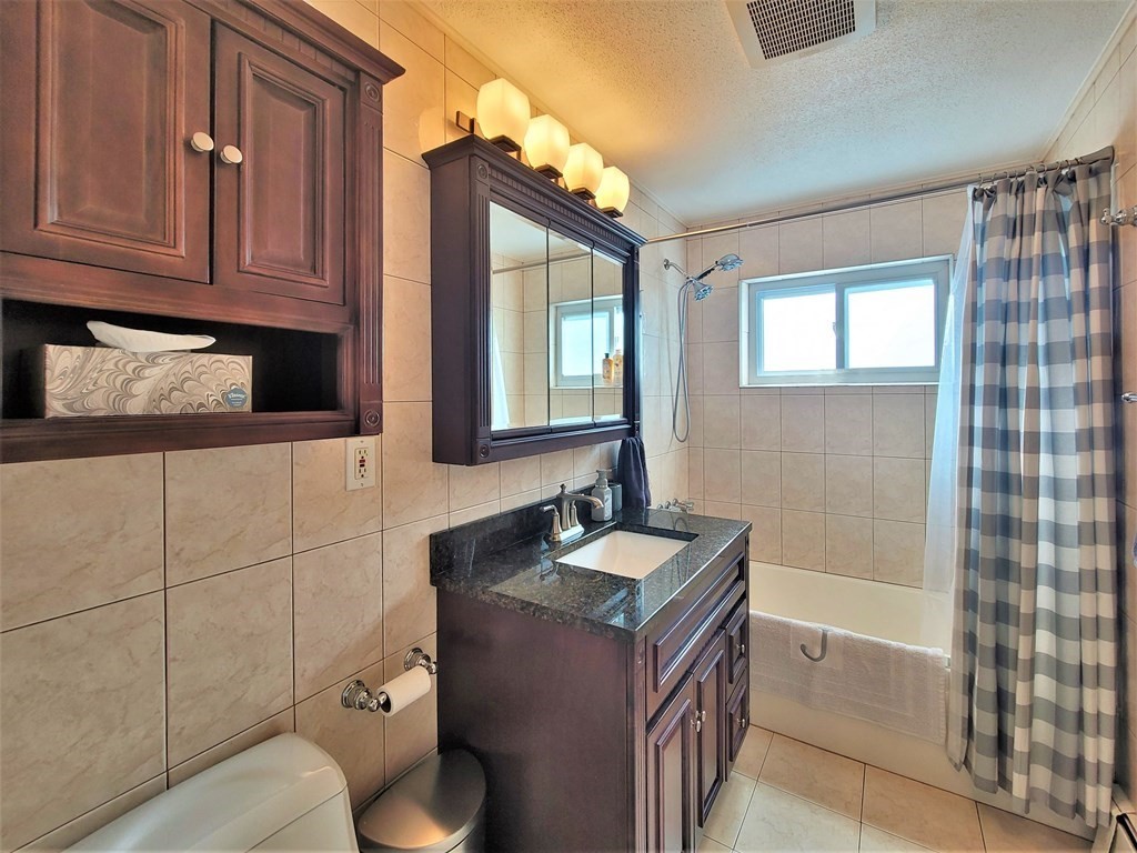 38 Will Drive, Unit 42 Canton, MA 02021 - Photo 17 of 25 a bathroom with a sink and a mirror