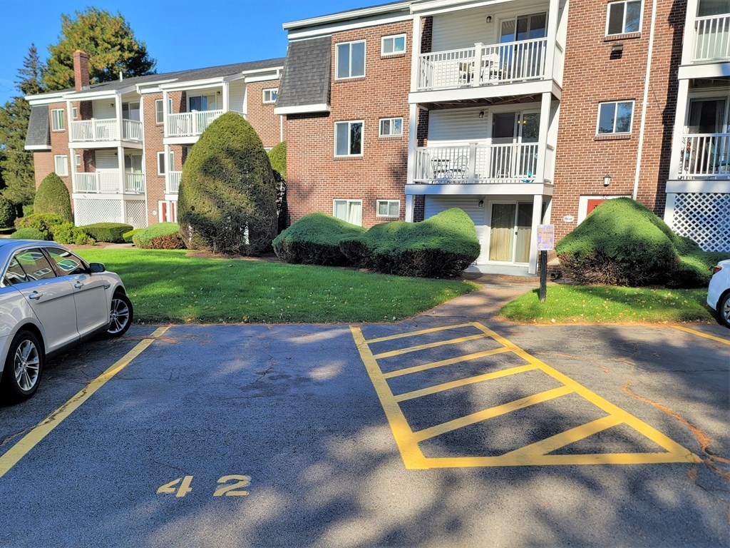 38 Will Drive, Unit 42 Canton, MA 02021 - Photo 23 of 25 a house view with a garden space
