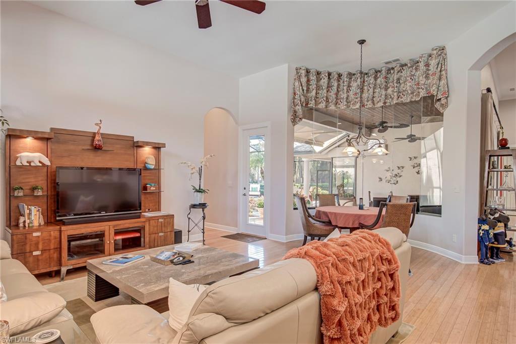 3126 Terramar Court Naples, FL 34119 - Photo 13 of 31 a living room with furniture and a flat screen tv