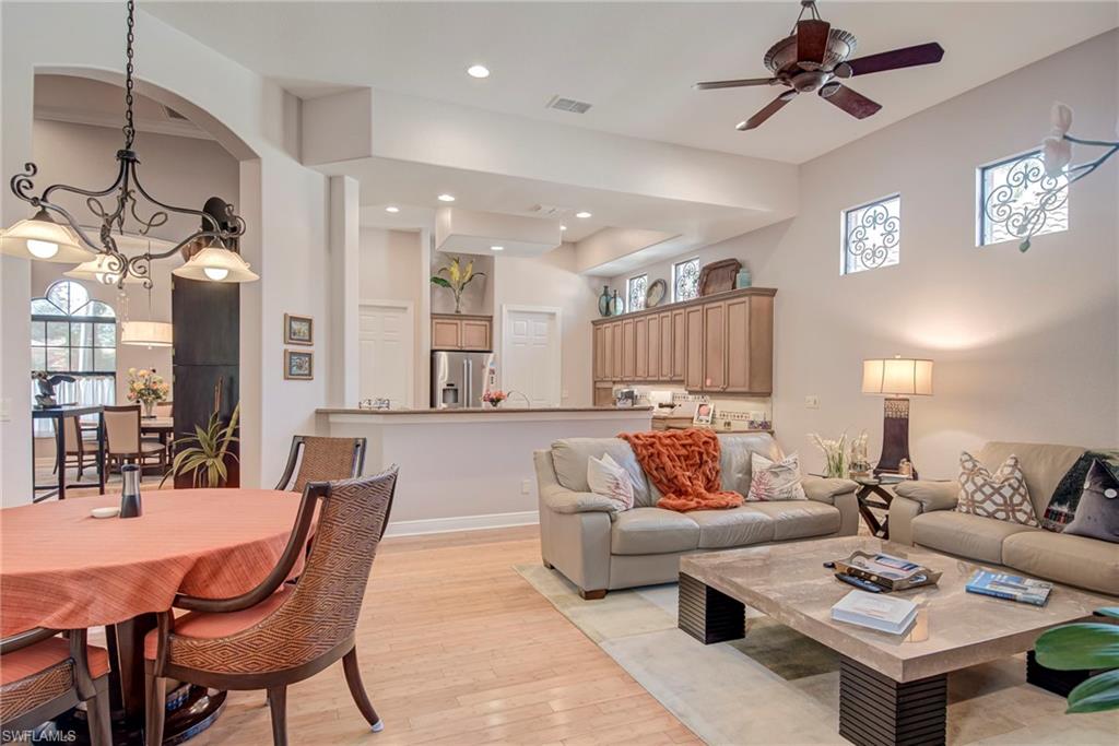 3126 Terramar Court Naples, FL 34119 - Photo 14 of 31 a living room with furniture and a chandelier