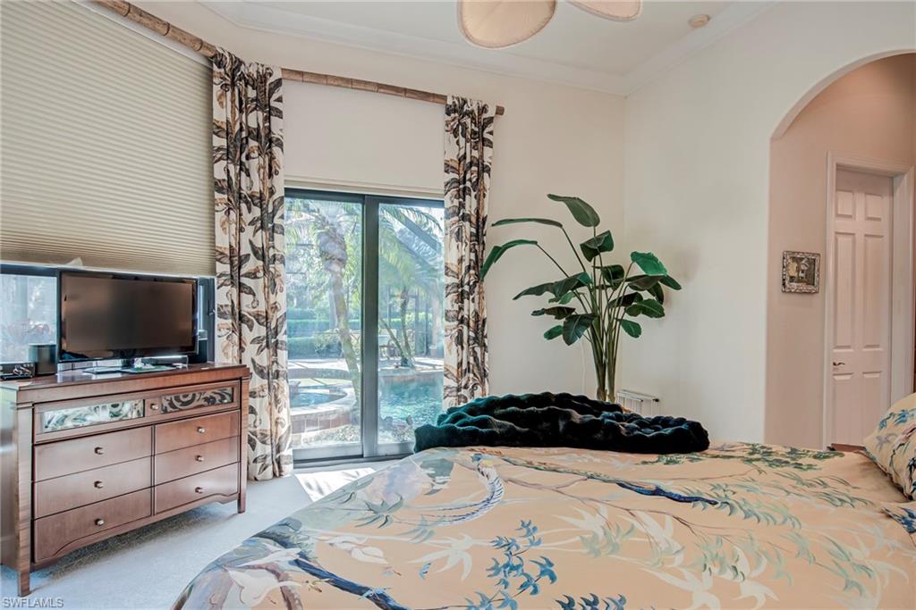 3126 Terramar Court Naples, FL 34119 - Photo 16 of 31 a living room with furniture and flat screen tv