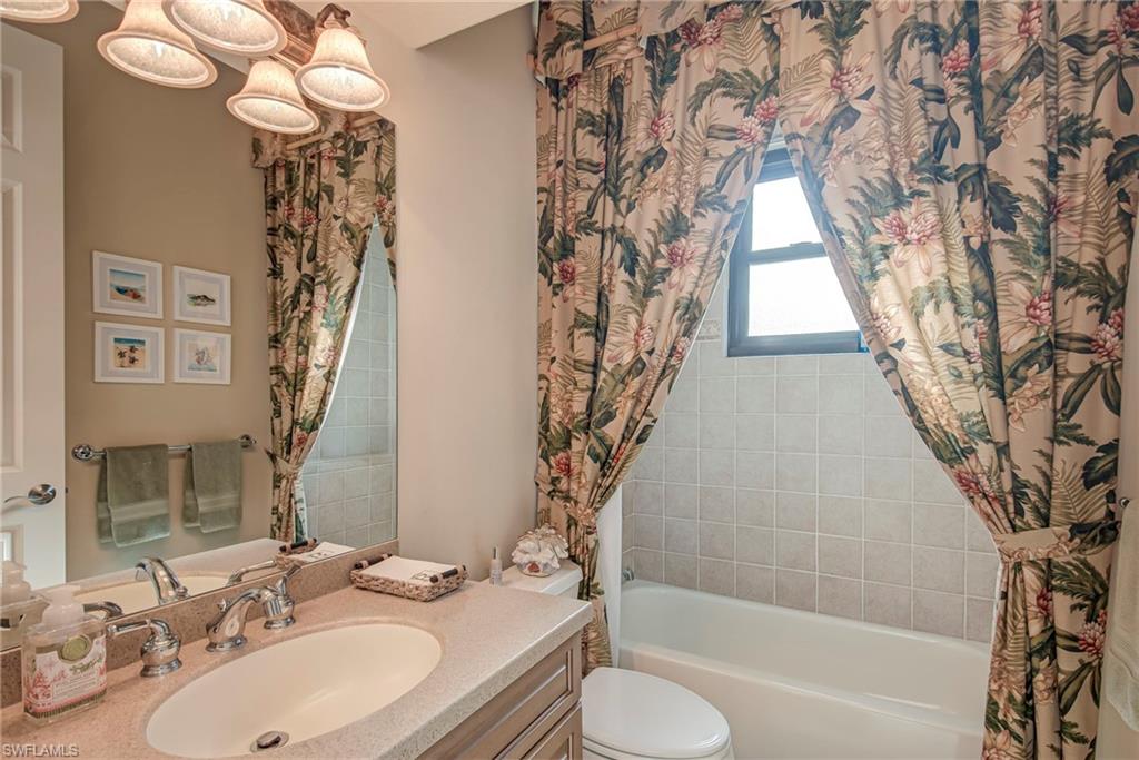 3126 Terramar Court Naples, FL 34119 - Photo 20 of 31 a bathroom with a bathtub and a sink