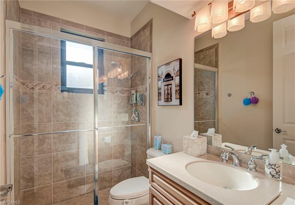 3126 Terramar Court Naples, FL 34119 - Photo 22 of 31 a bathroom with a sink toilet and shower