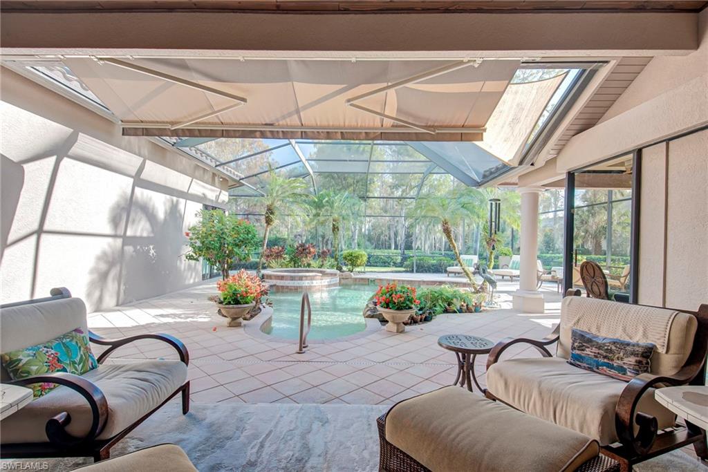 3126 Terramar Court Naples, FL 34119 - Photo 24 of 31 a living room with furniture and a table