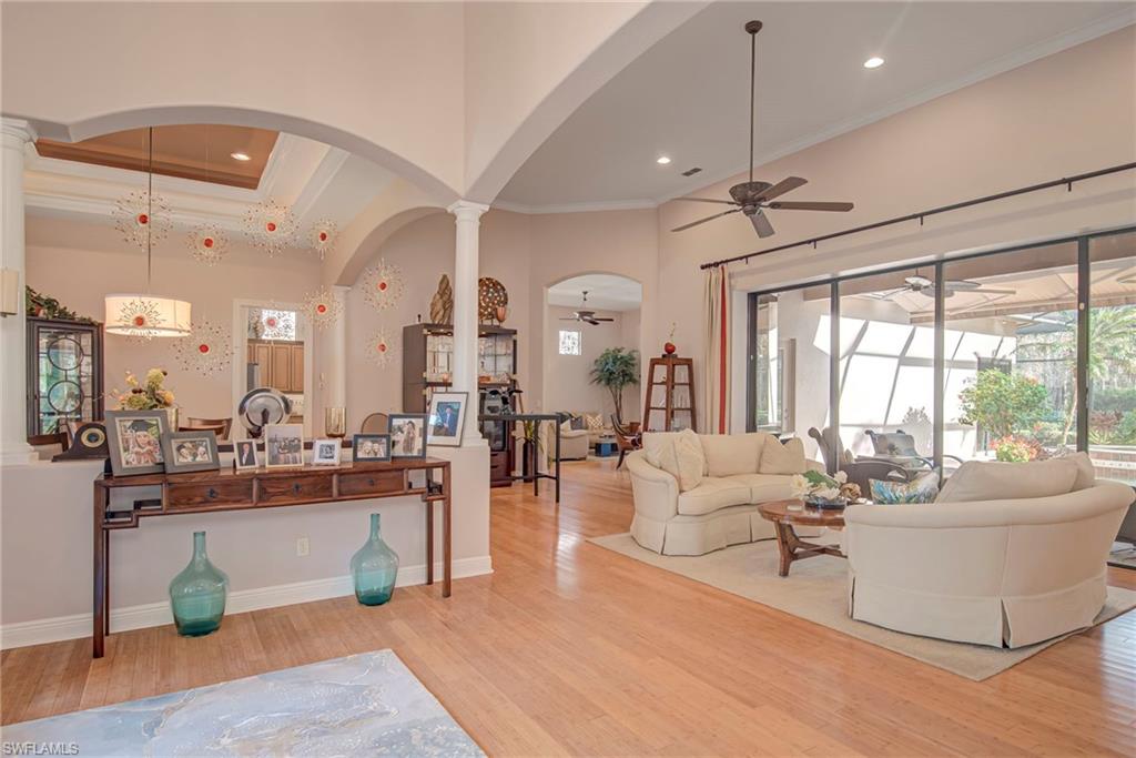 3126 Terramar Court Naples, FL 34119 - Photo 3 of 31 a living room with furniture and a large window