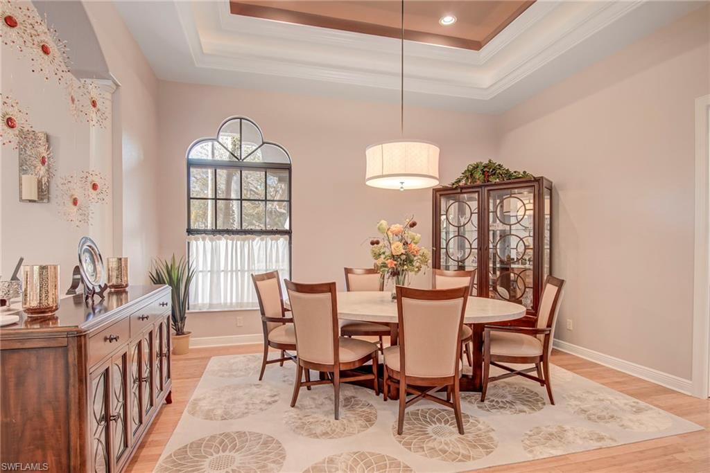 3126 Terramar Court Naples, FL 34119 - Photo 7 of 31 a view of a dining room with furniture