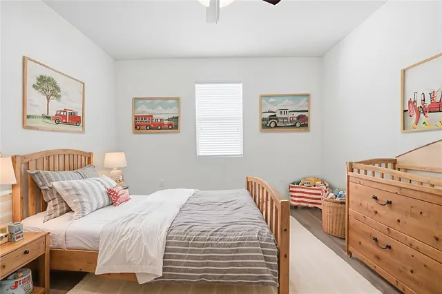 a bedroom with a bed and a desk