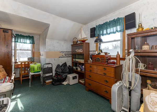 a bed room with furniture and a window
