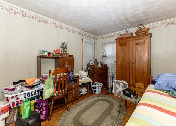 a bedroom with bed and a closet