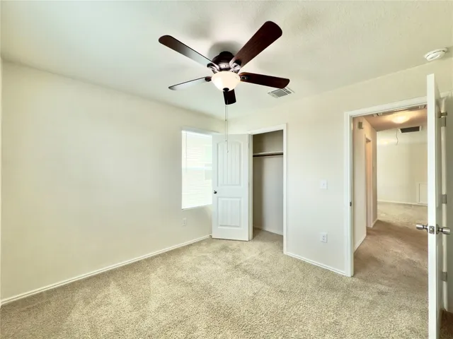 a view of room with ceiling fan
