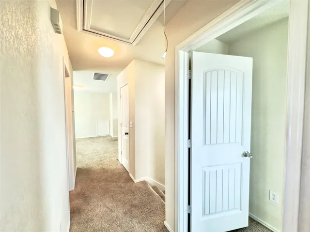 a view of a bathroom with a shower and a sink