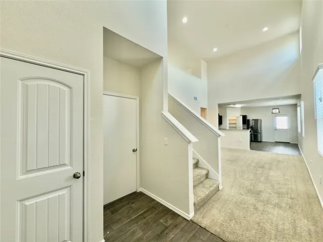 a view of entryway with wooden floor and stair