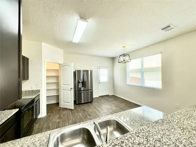 a bedroom with a bed and flat screen tv