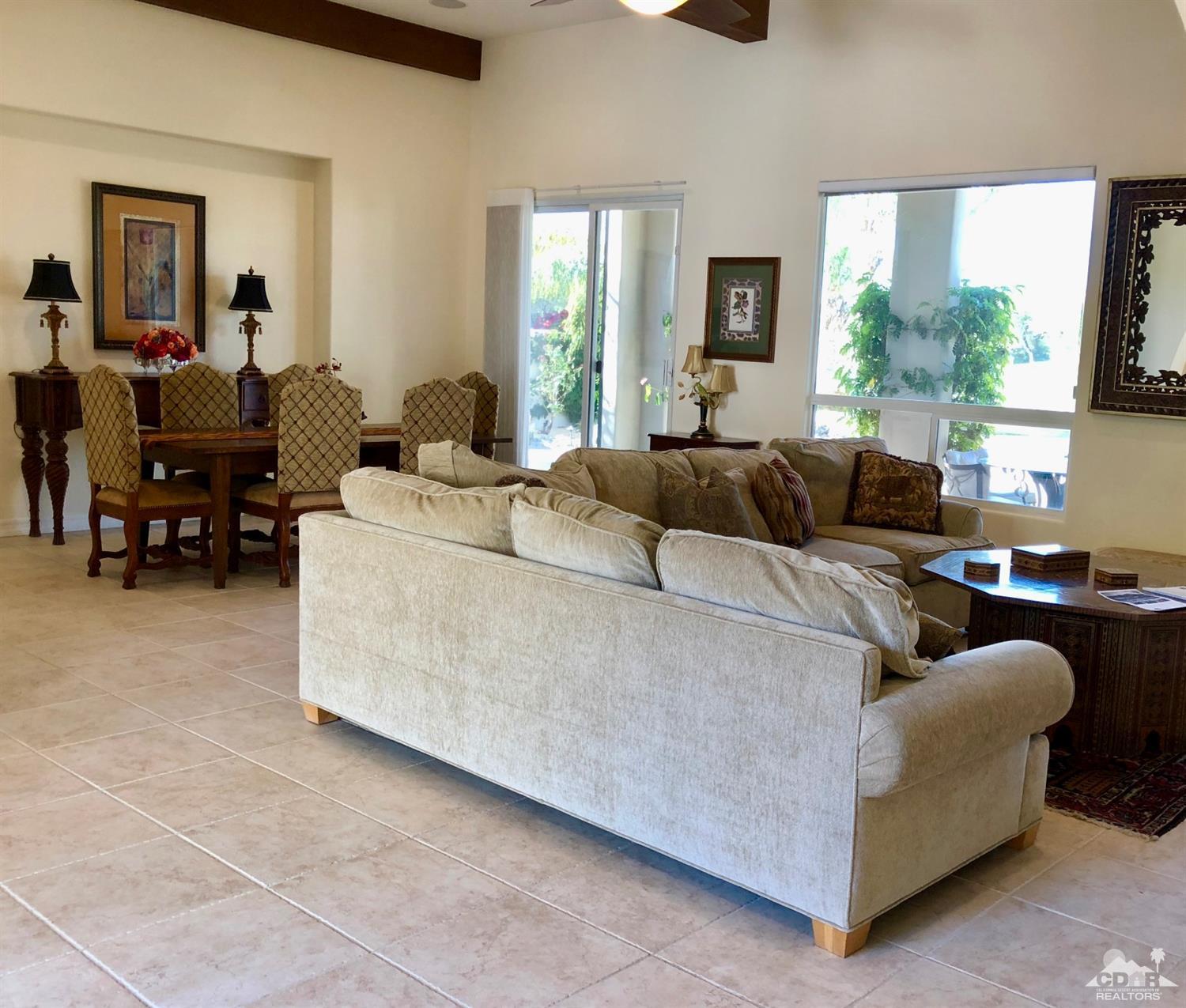 388 Loch Lomond Road Rancho Mirage, CA 92270 - Photo 11 of 41 a living room with furniture and a large window