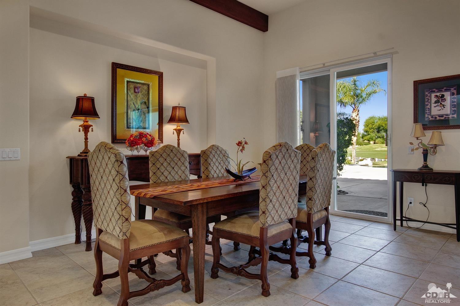 388 Loch Lomond Road Rancho Mirage, CA 92270 - Photo 13 of 41 a view of a dining room with furniture and a potted plant