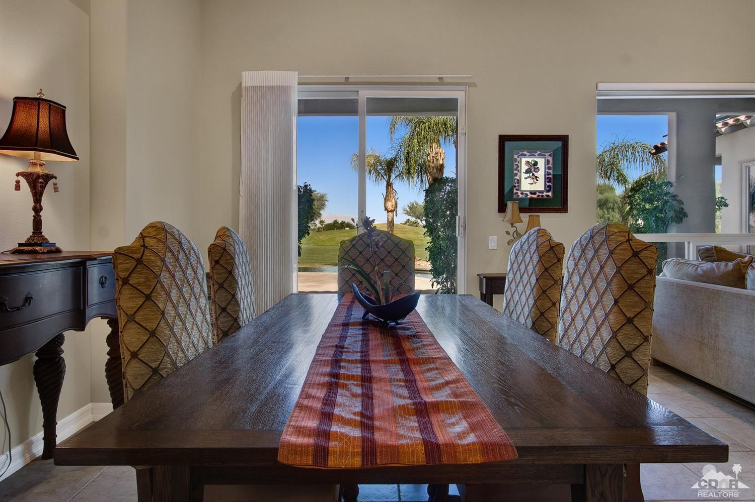 388 Loch Lomond Road Rancho Mirage, CA 92270 - Photo 14 of 41 a living room with furniture and a chandelier