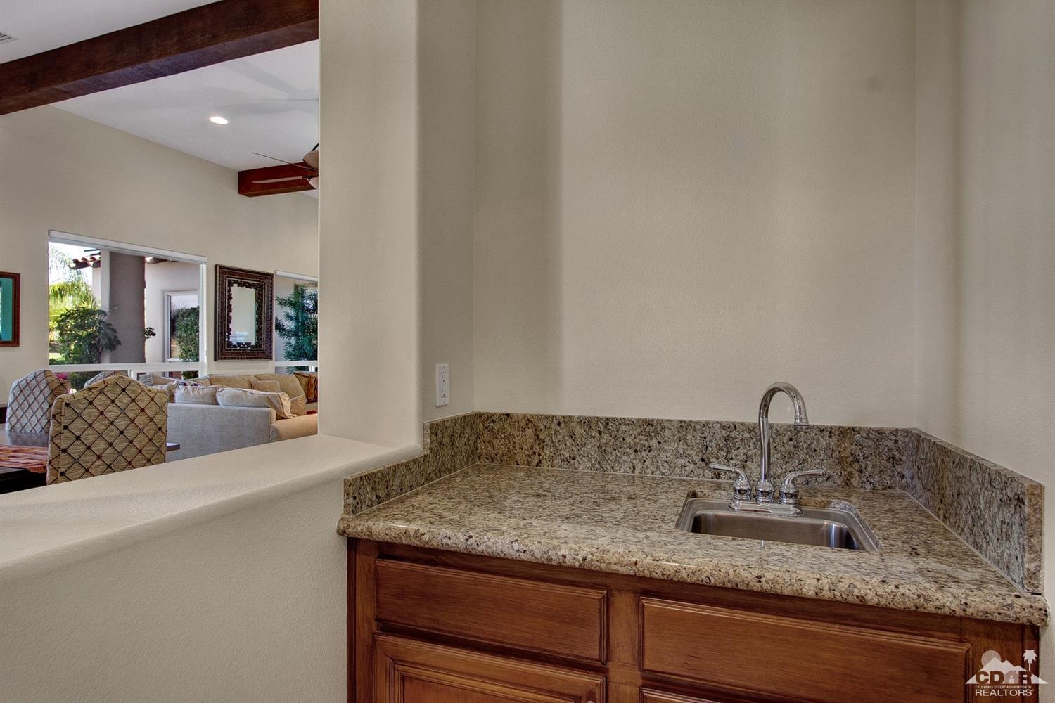388 Loch Lomond Road Rancho Mirage, CA 92270 - Photo 15 of 41 a en suite bathroom with a granite countertop sink and a mirror