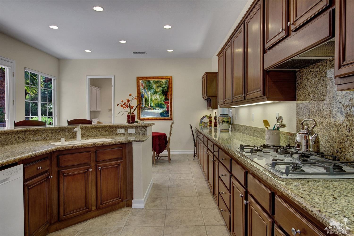 388 Loch Lomond Road Rancho Mirage, CA 92270 - Photo 19 of 41 a kitchen with sink stove and cabinets