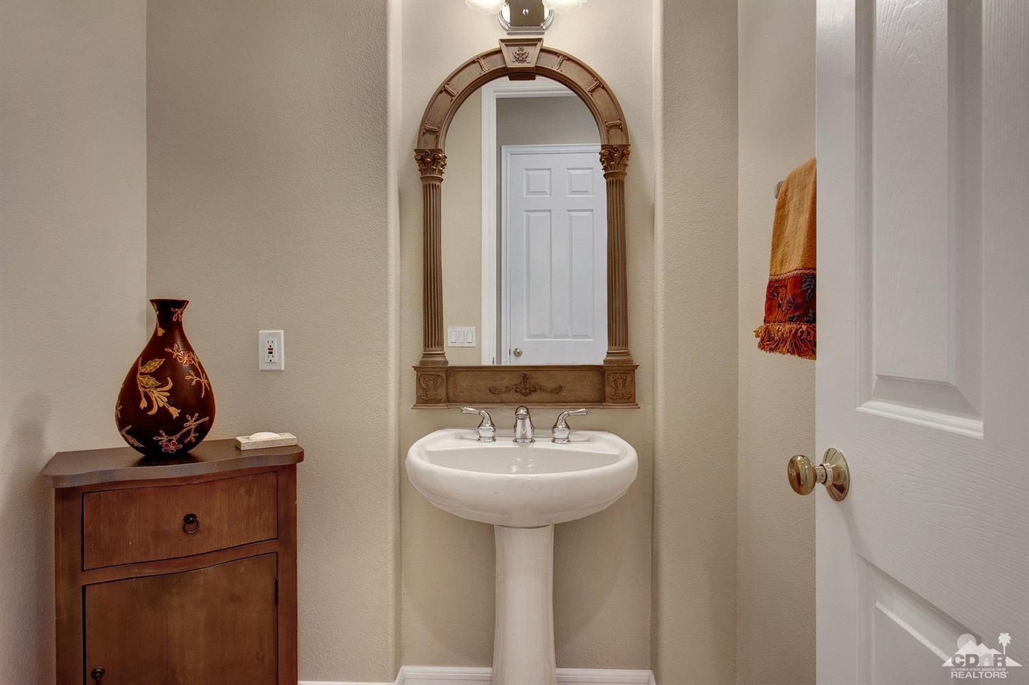 388 Loch Lomond Road Rancho Mirage, CA 92270 - Photo 22 of 41 a bathroom with a sink and a mirror
