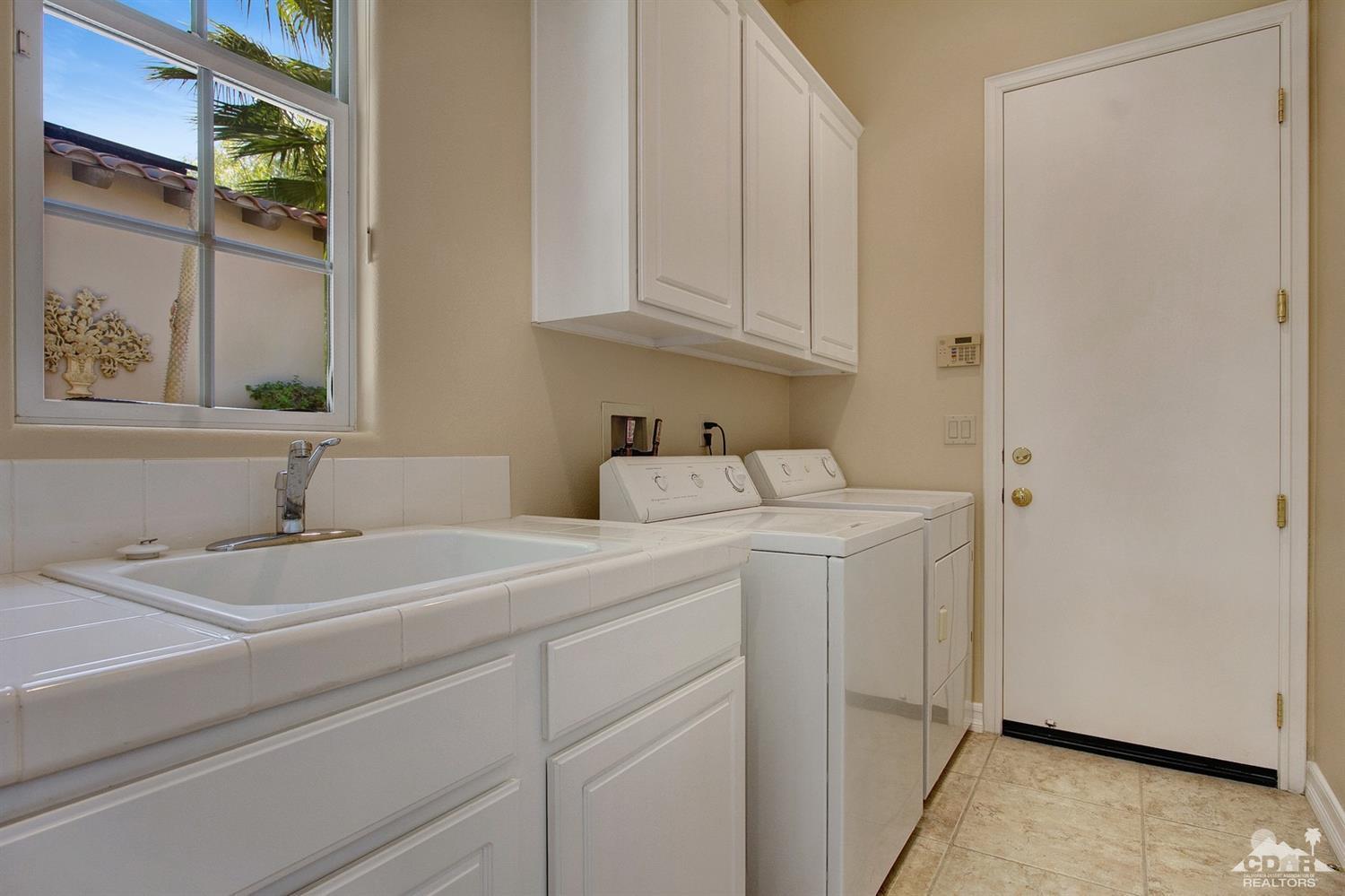 388 Loch Lomond Road Rancho Mirage, CA 92270 - Photo 23 of 41 a utility room with dryer and washer