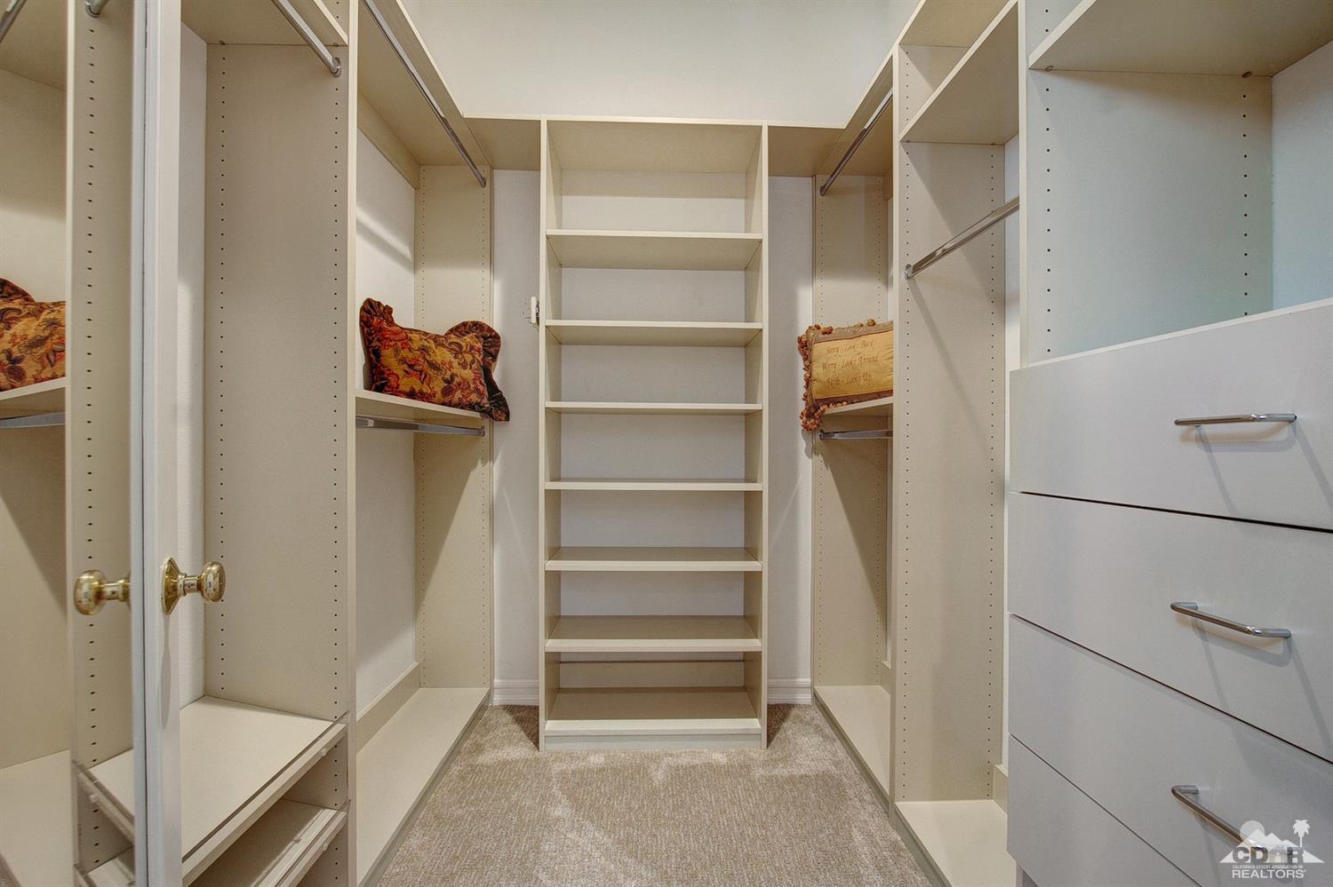 388 Loch Lomond Road Rancho Mirage, CA 92270 - Photo 29 of 41 a view of walk in closet with empty racks