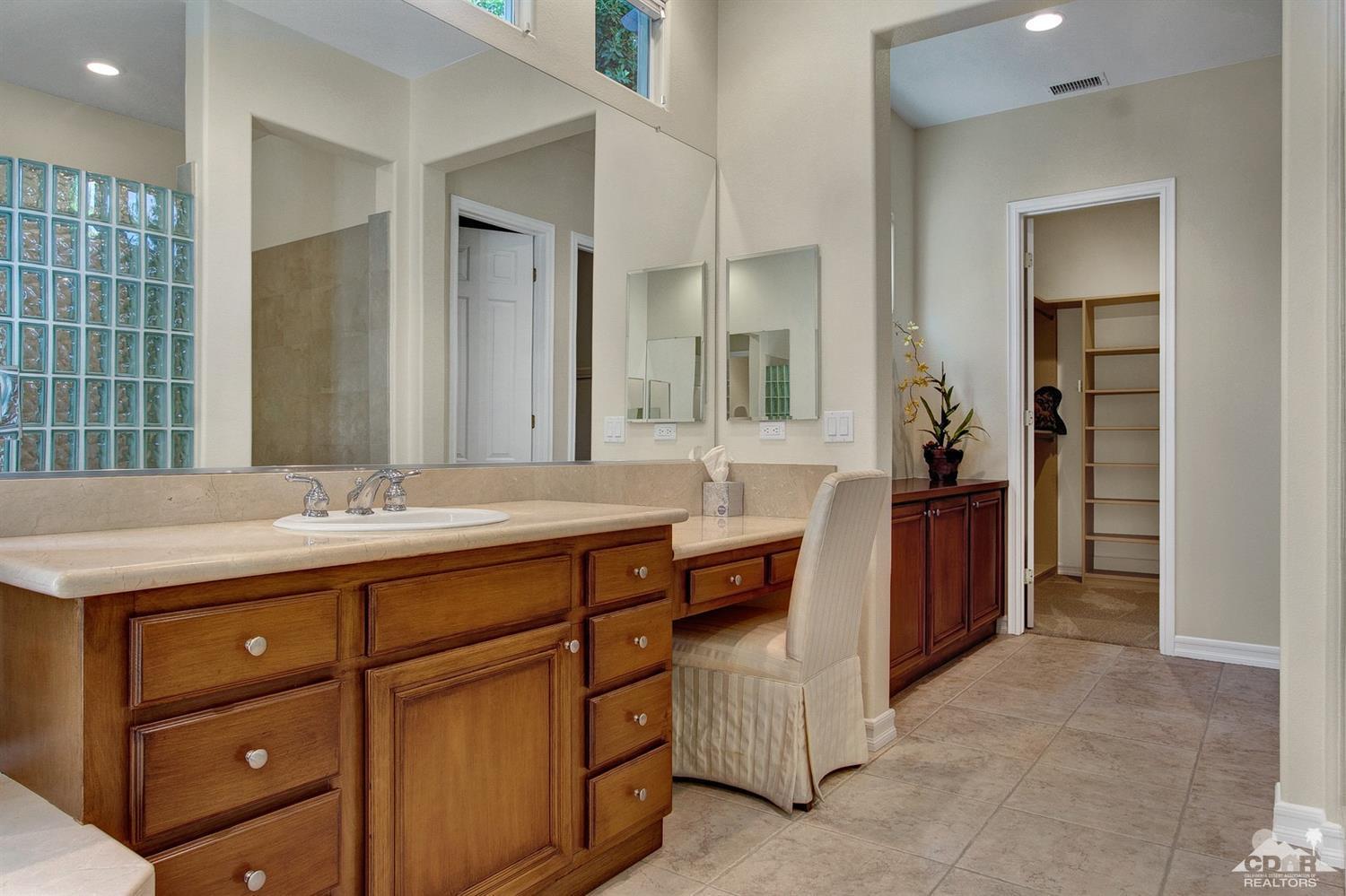 388 Loch Lomond Road Rancho Mirage, CA 92270 - Photo 30 of 41 a spacious bathroom with a granite countertop double vanity sink a mirror and a bathtub