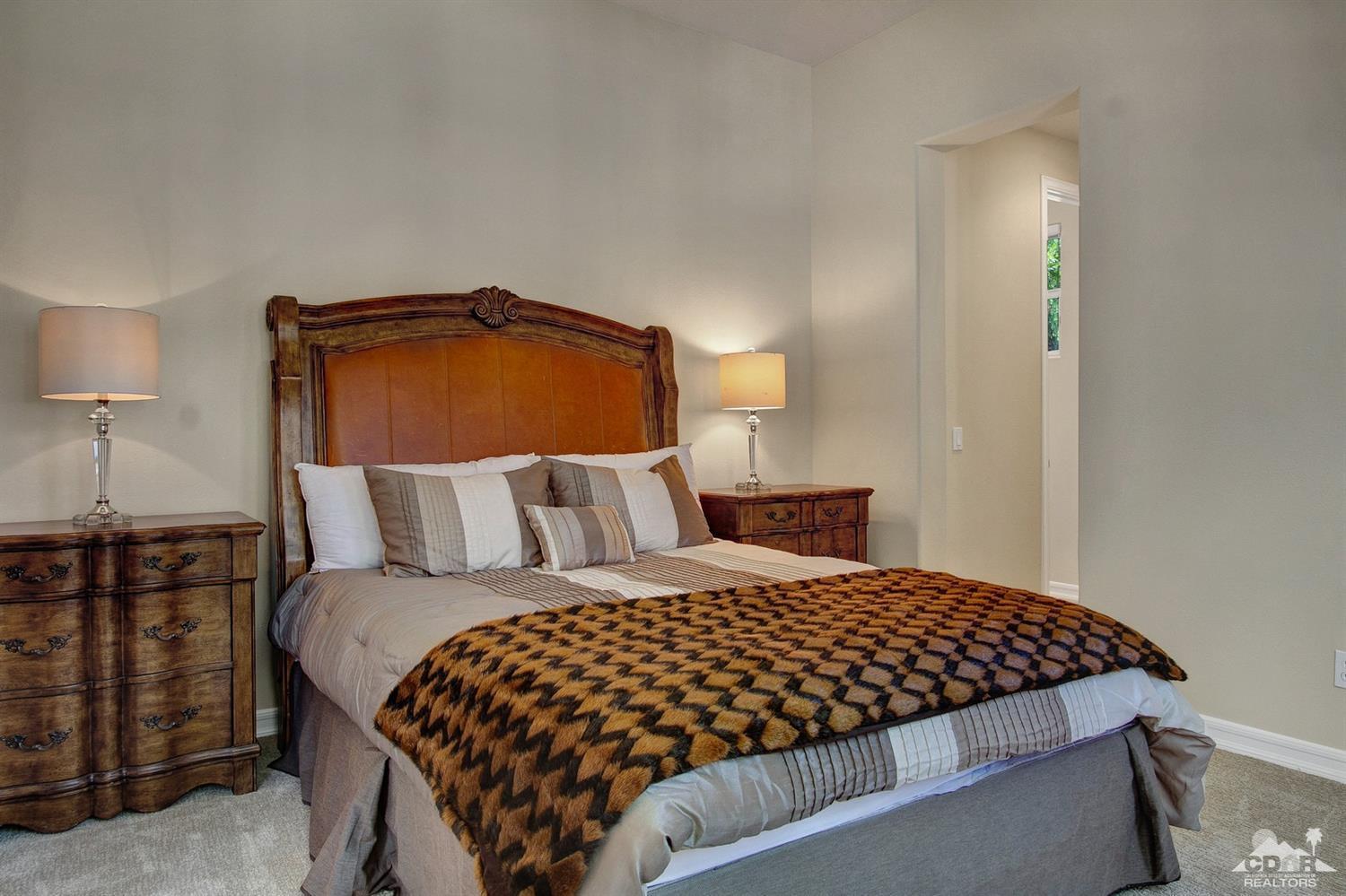 388 Loch Lomond Road Rancho Mirage, CA 92270 - Photo 33 of 41 a bedroom with a bed and a lamp