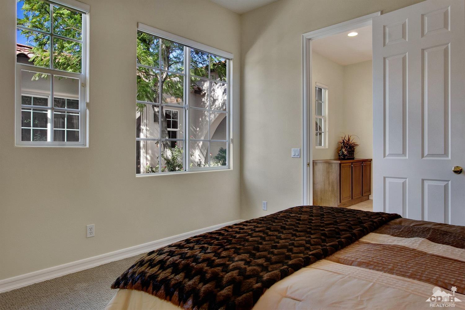 388 Loch Lomond Road Rancho Mirage, CA 92270 - Photo 34 of 41 a bedroom with a bed and a window
