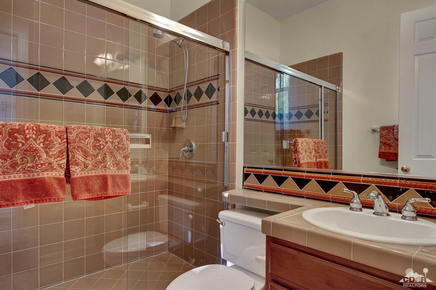 388 Loch Lomond Road Rancho Mirage, CA 92270 - Photo 35 of 41 a bathroom with a sink and a mirror