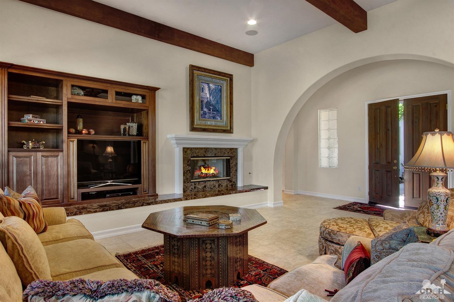 388 Loch Lomond Road Rancho Mirage, CA 92270 - Photo 5 of 41 a living room with furniture and a fireplace