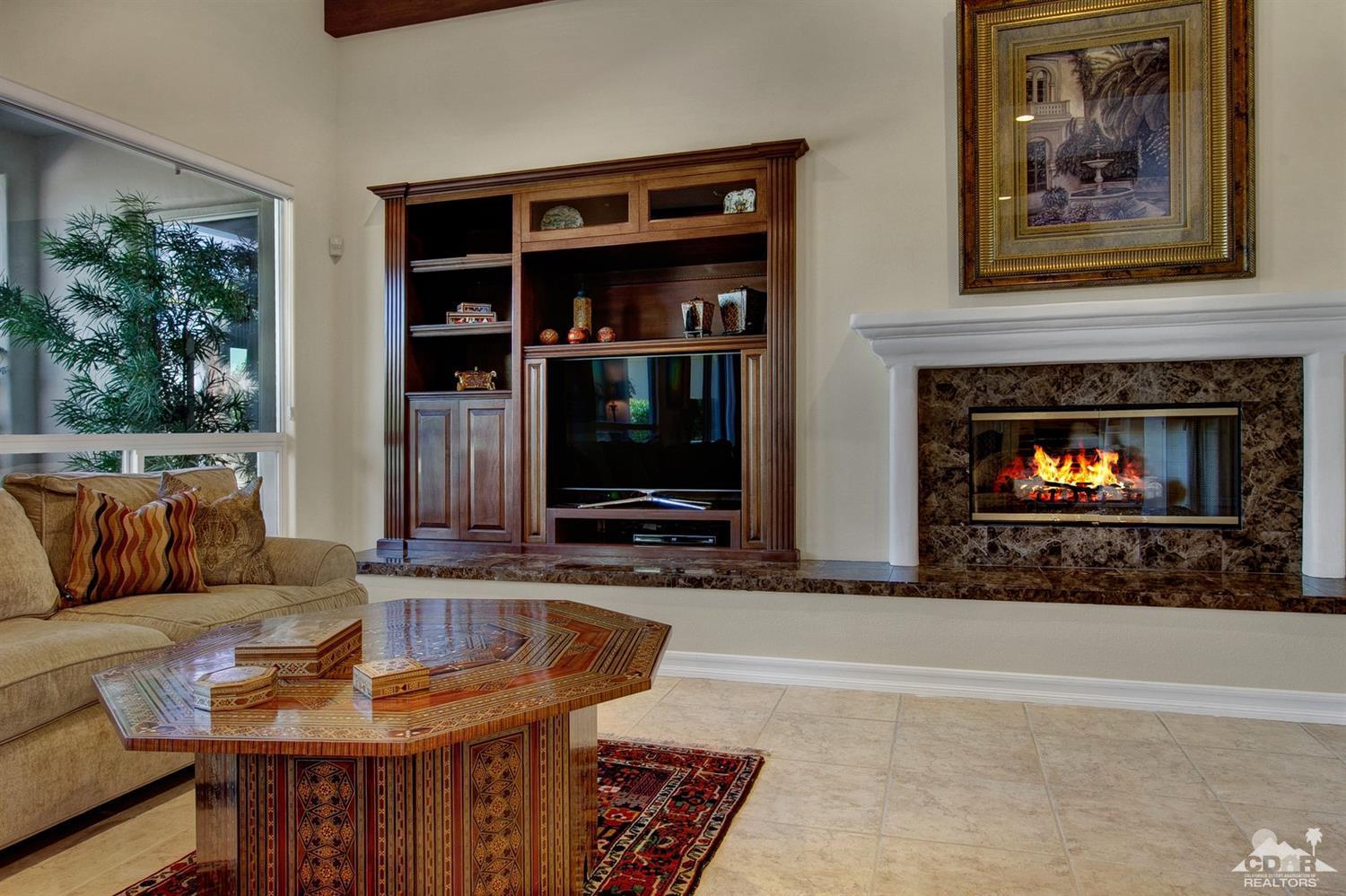 388 Loch Lomond Road Rancho Mirage, CA 92270 - Photo 7 of 41 a living room with furniture and a fireplace
