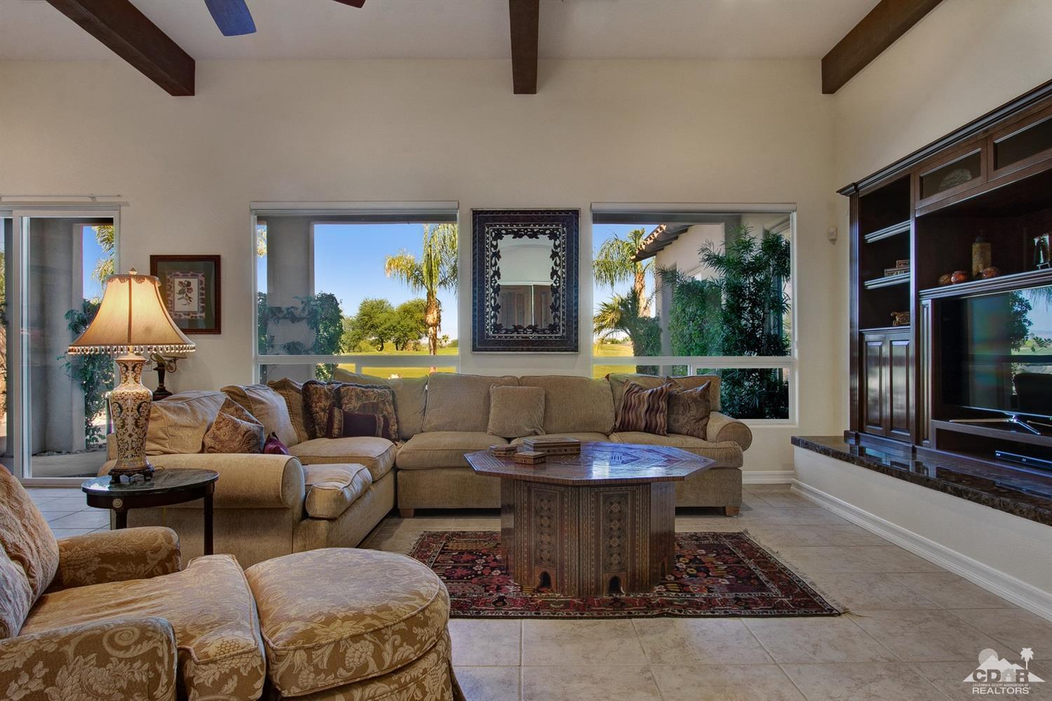 388 Loch Lomond Road Rancho Mirage, CA 92270 - Photo 8 of 41 a living room with furniture and a flat screen tv