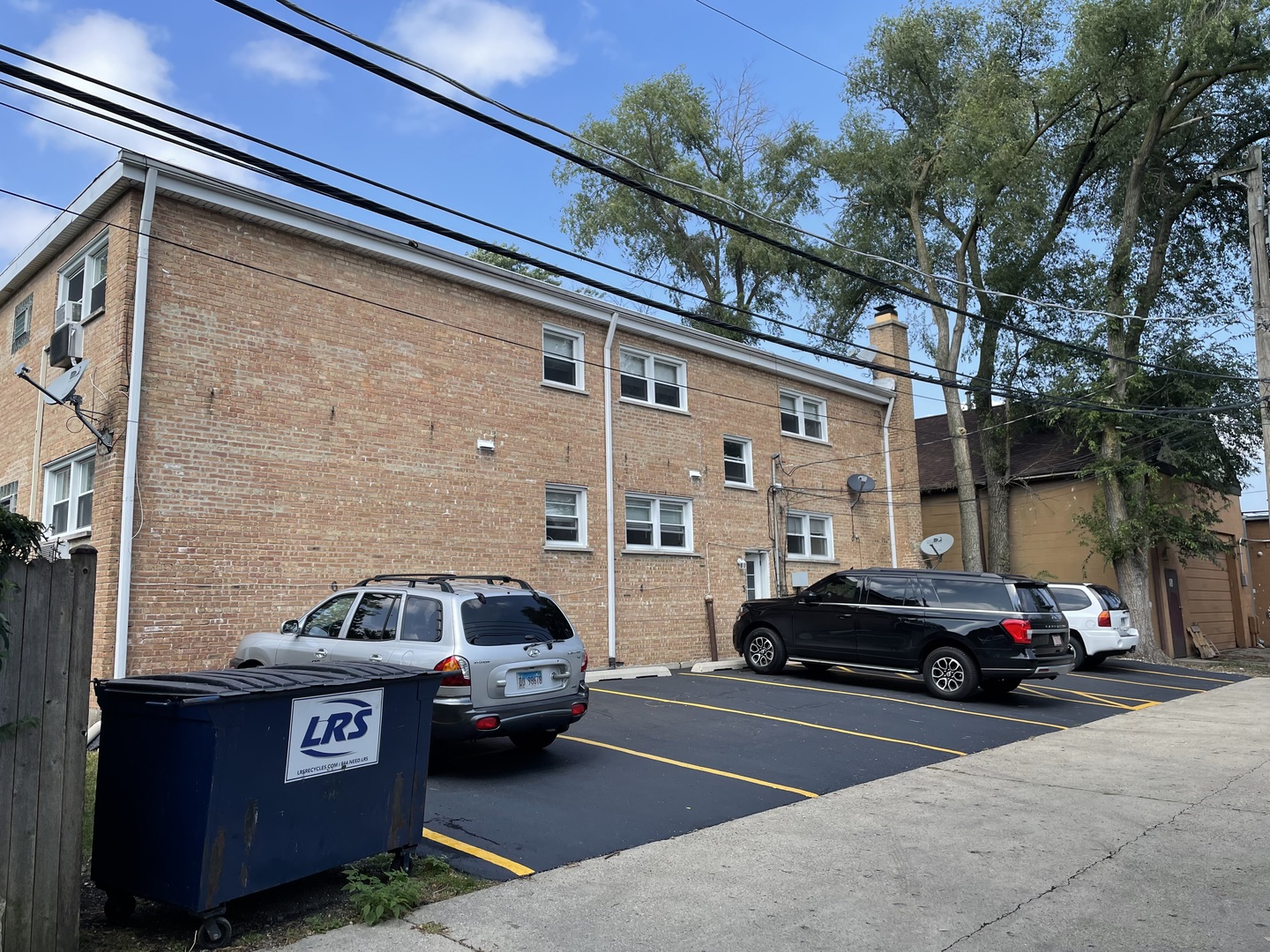 8743-45 East Prairie Road Skokie, IL 60076 - Photo 3 of 21 a view of a car parked in front of a building
