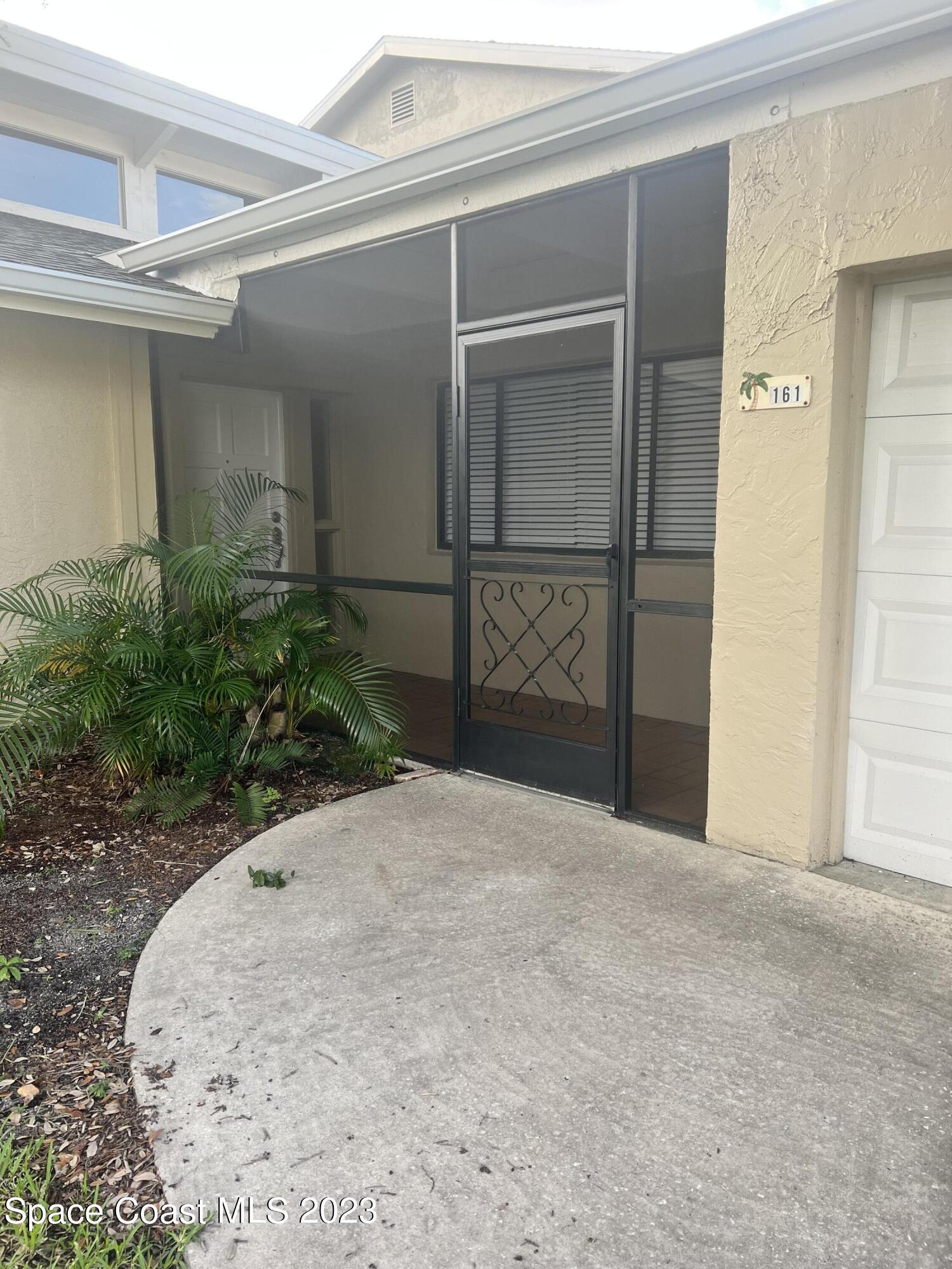 161 Augusta Way Melbourne, FL 32940 - Photo 2 of 26 a view of a garage
