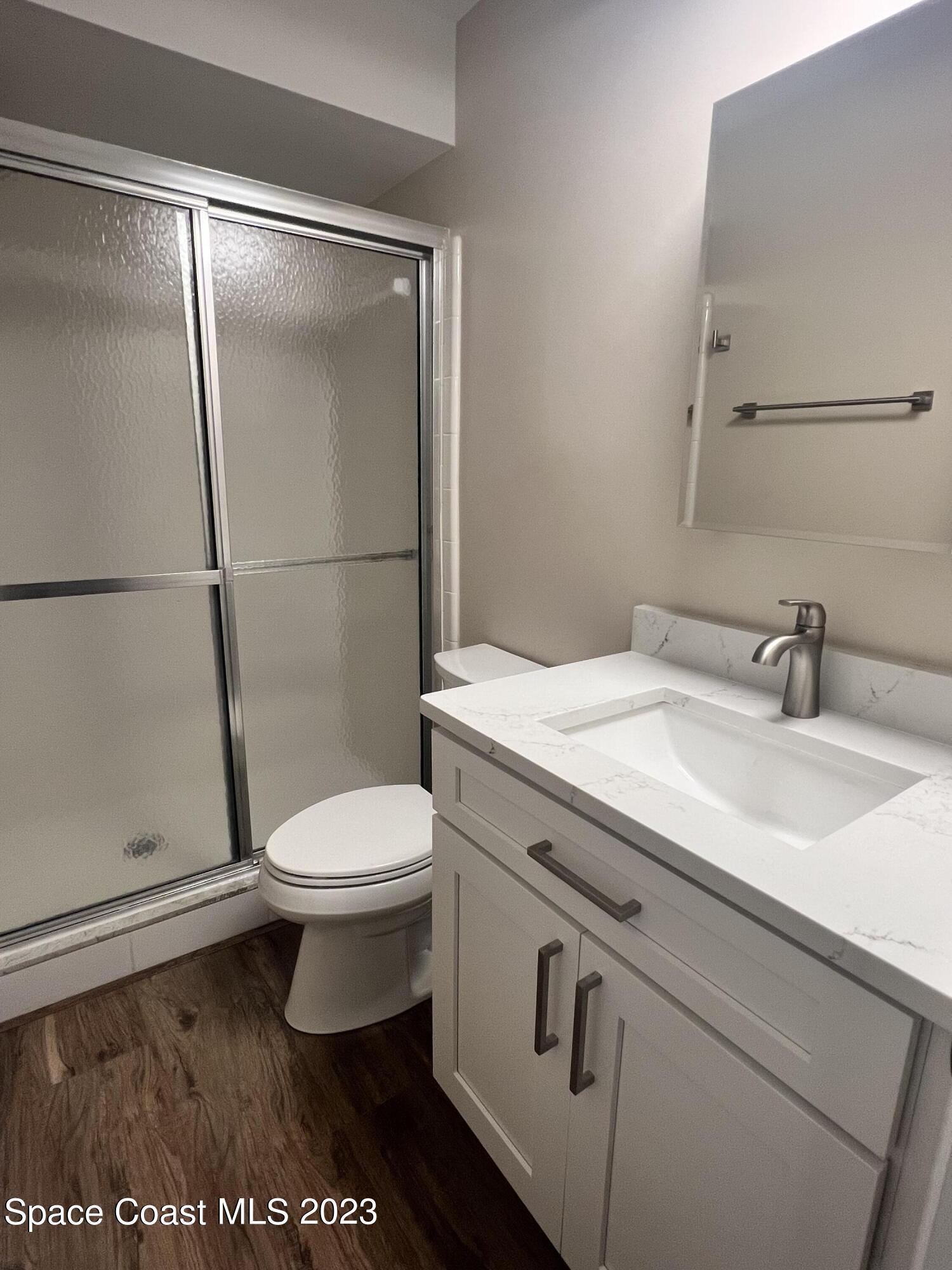 161 Augusta Way Melbourne, FL 32940 - Photo 21 of 26 a bathroom with a sink a toilet and a shower