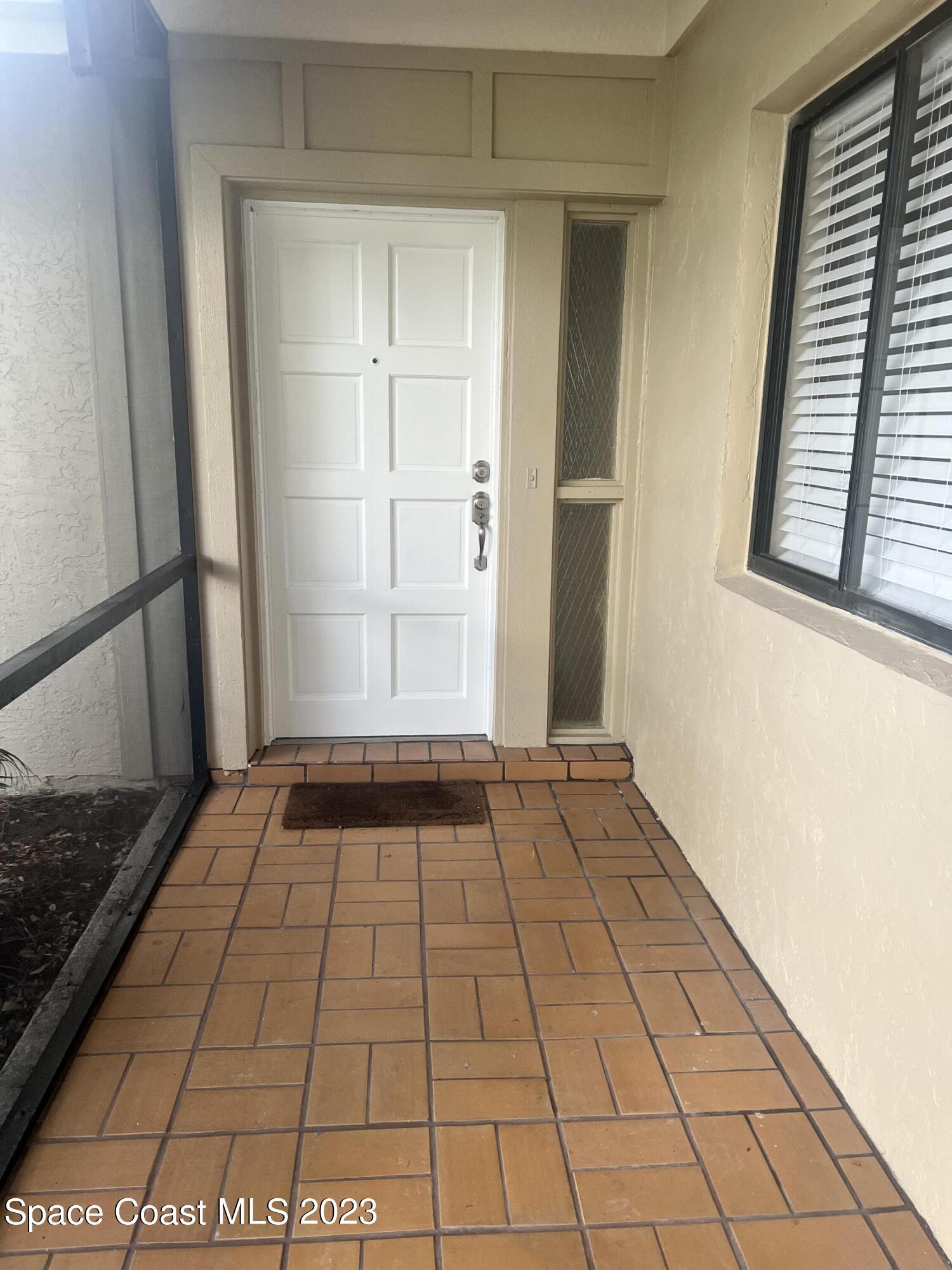 161 Augusta Way Melbourne, FL 32940 - Photo 4 of 26 a view of an empty room and window