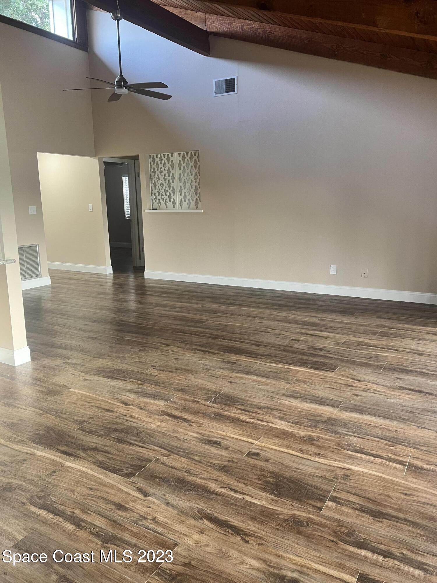161 Augusta Way Melbourne, FL 32940 - Photo 8 of 26 a view of a livingroom with wooden floor