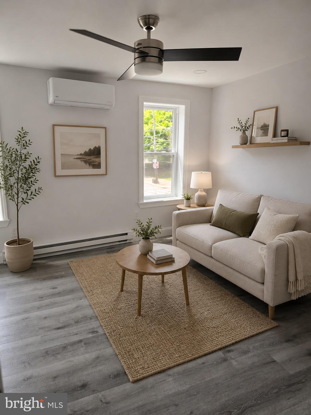 5925 Ridge Avenue, Unit 5 Philadelphia, PA 19128 - Photo 6 of 31 a living room with furniture and a window