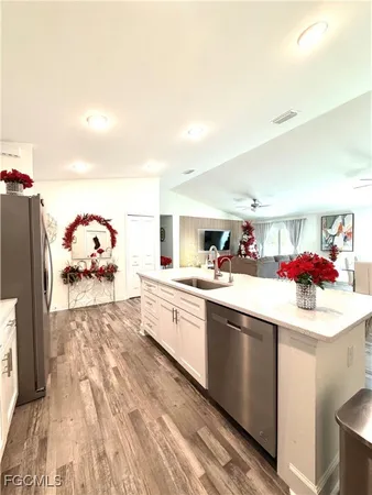 a kitchen with a sink stove and cabinets