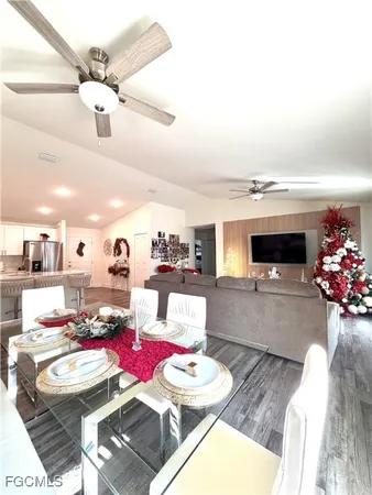 a living room with furniture and flat screen tv