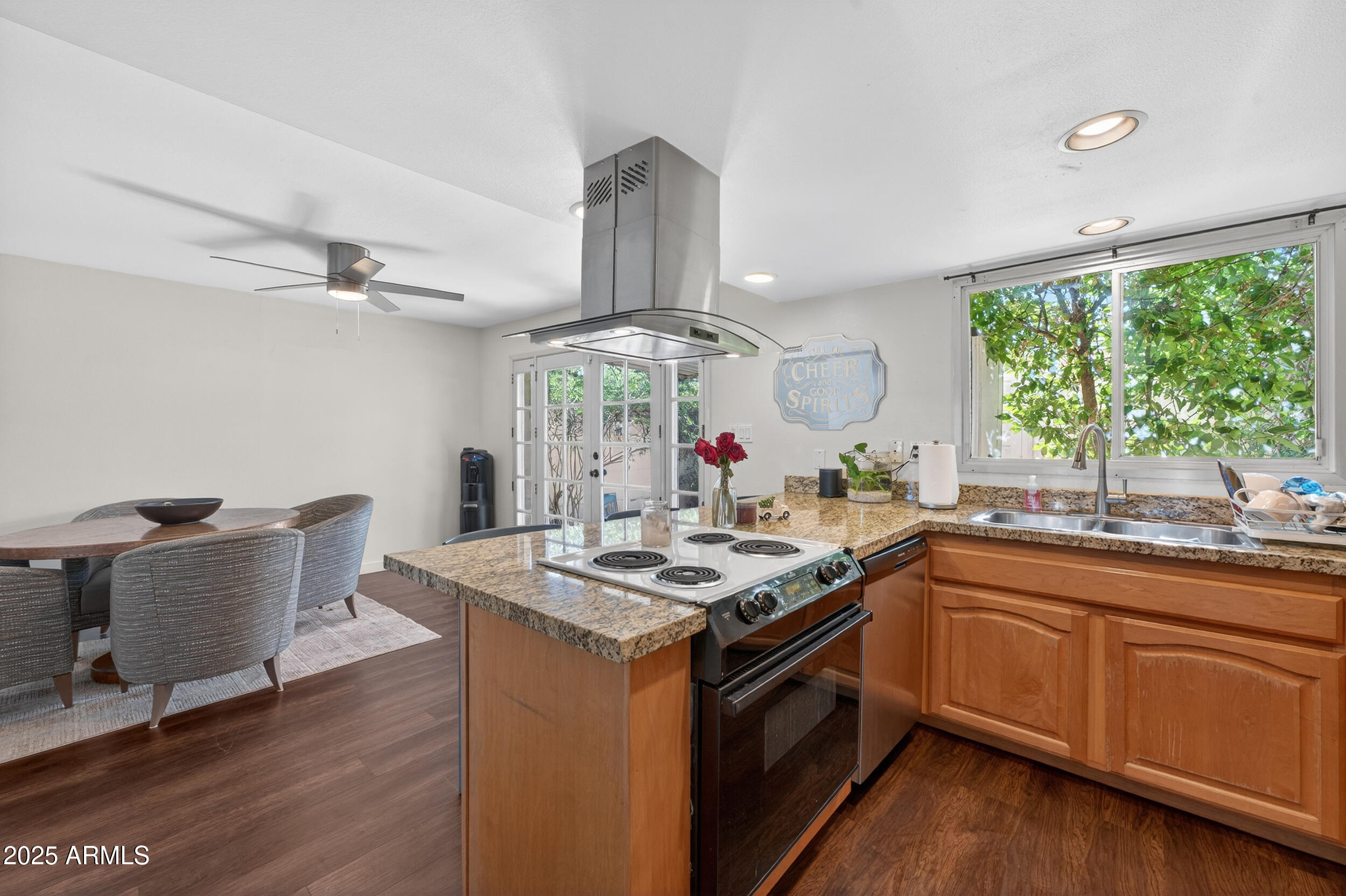 3929 South Mill Avenue Tempe, AZ 85282 - Photo 2 of 26 a kitchen with a sink and wooden cabinets